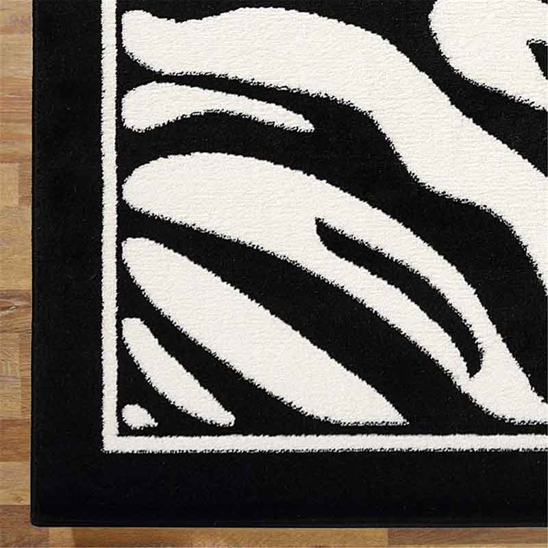 lux street zebra pattern black and white floor rug corner detail
